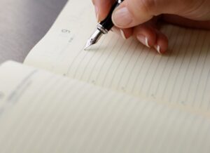Verve News Articles Hand writing with fountain pen on paper