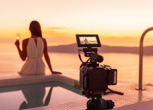 Person Sitting Camera Filming Sunset