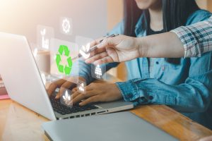 Person Using Laptop Green Recycling Icons