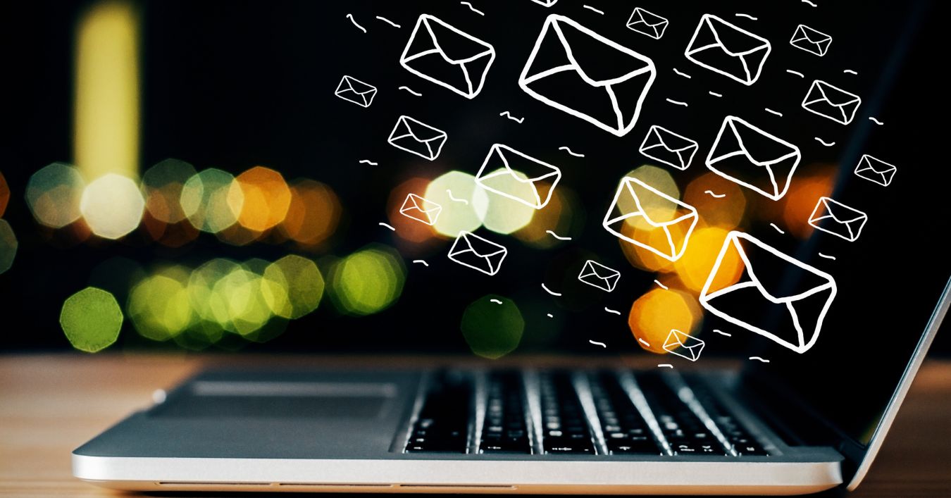Laptop with emails coming out of it