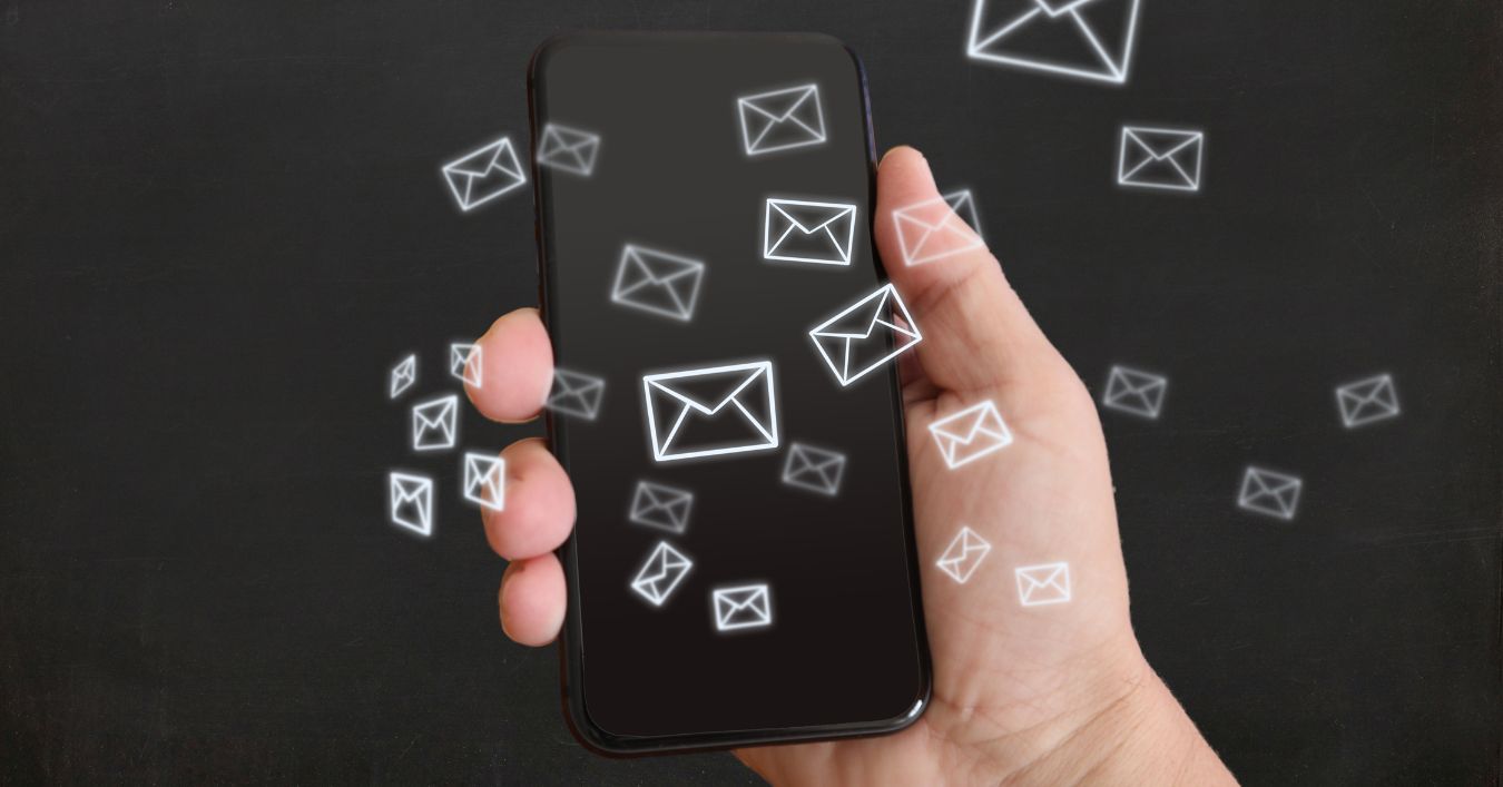 Mobile Phone With Emails Icons Coming out of it.