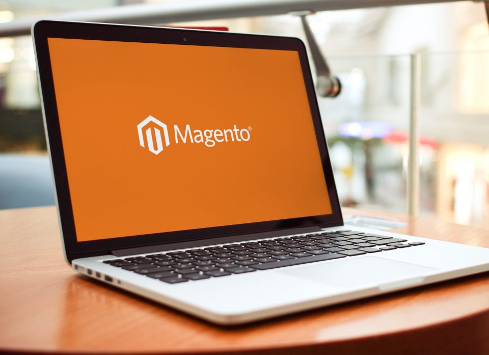 Magento logo featured on laptop