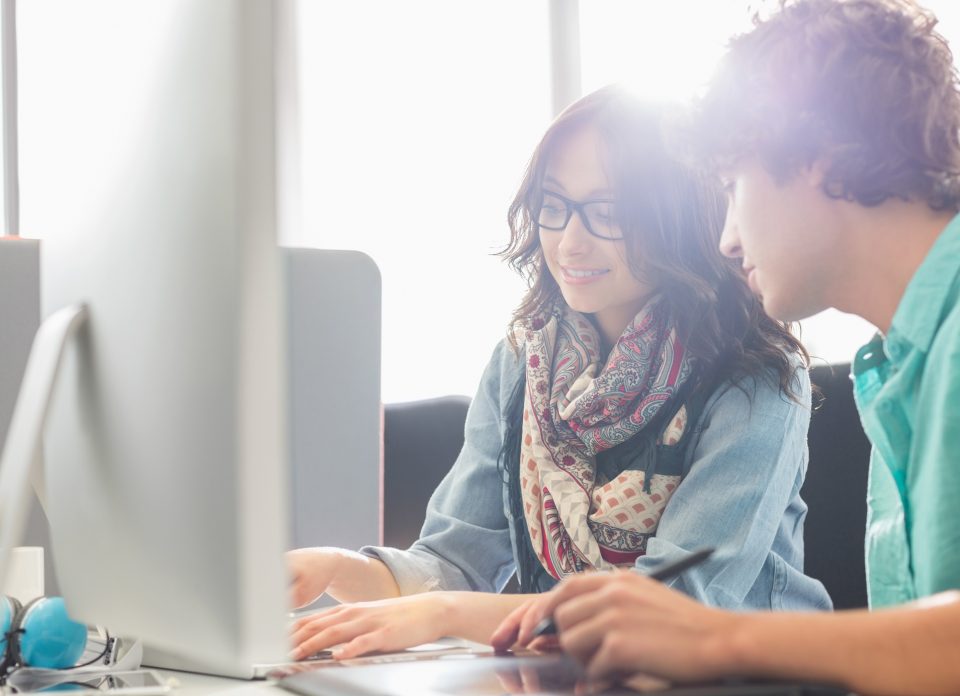 Verve News Articles Two people working at a computer