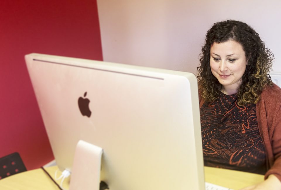 Sarai Gill sitting at computer