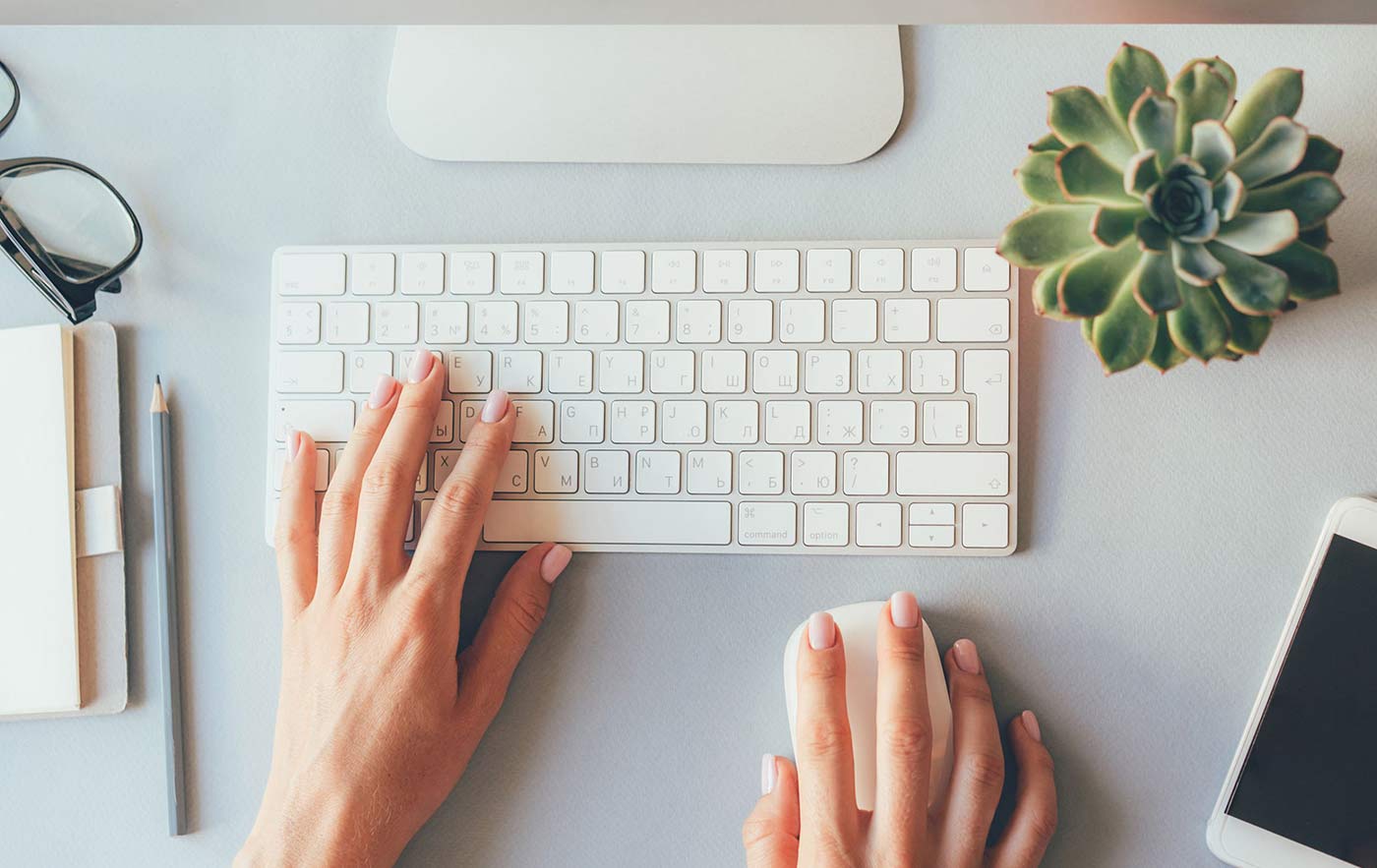 Keyboard with lady's painted nails typing